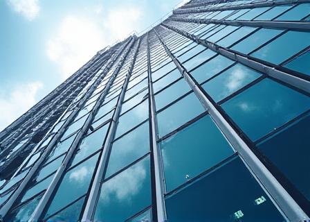 Architectural detail of a modern London office building reflecting the City
